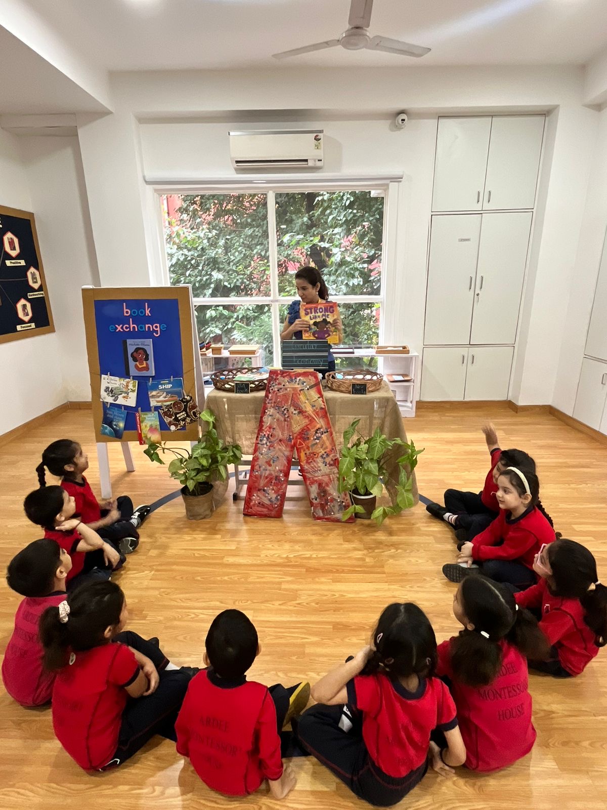 Children taking part in a classroom book exchange session