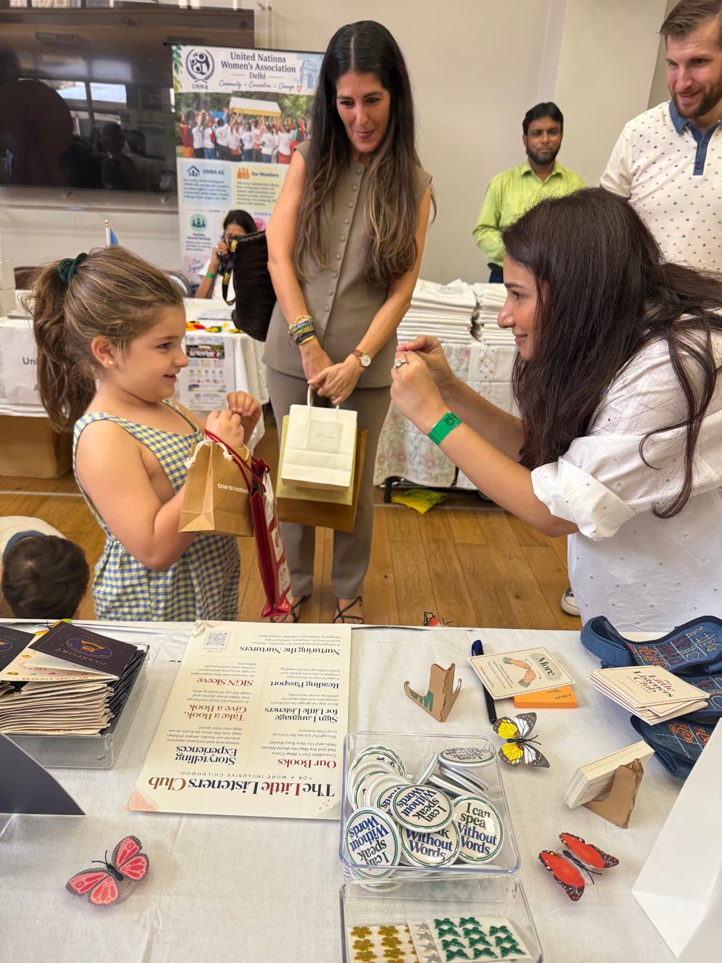 Spardha Chaturvedi speaking with a child at a community event
