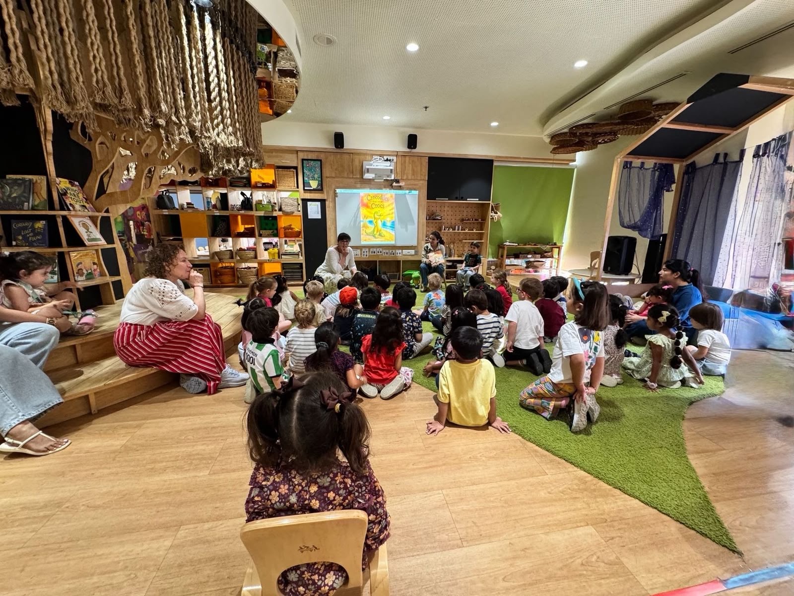 Children gathered for an interactive classroom story session
