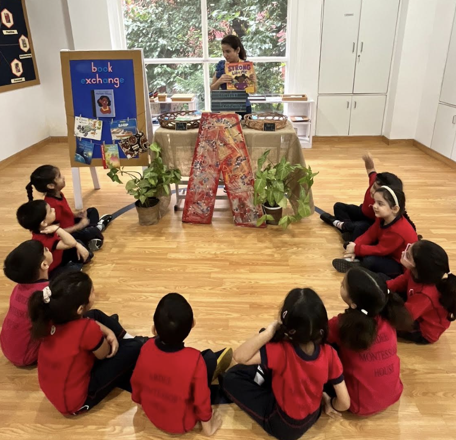 Spardha reading with children at a Book Nook session